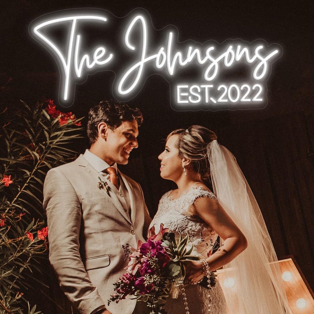 example neon LED sign with wedding couple below